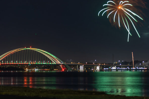 Side view photo of fireworks at I-74 Mississippi River Bridge