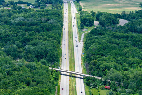 A photo from above of highway from above and a highway bridge