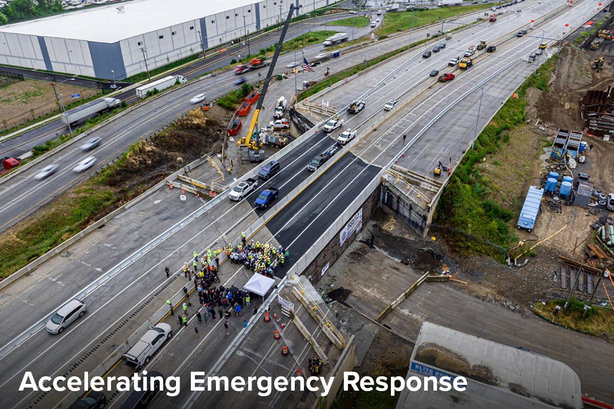 Aerial view of I-95 after the collapsed section of the bridge was replaced and reopened to traffic, with three lanes carrying traffic in each direction