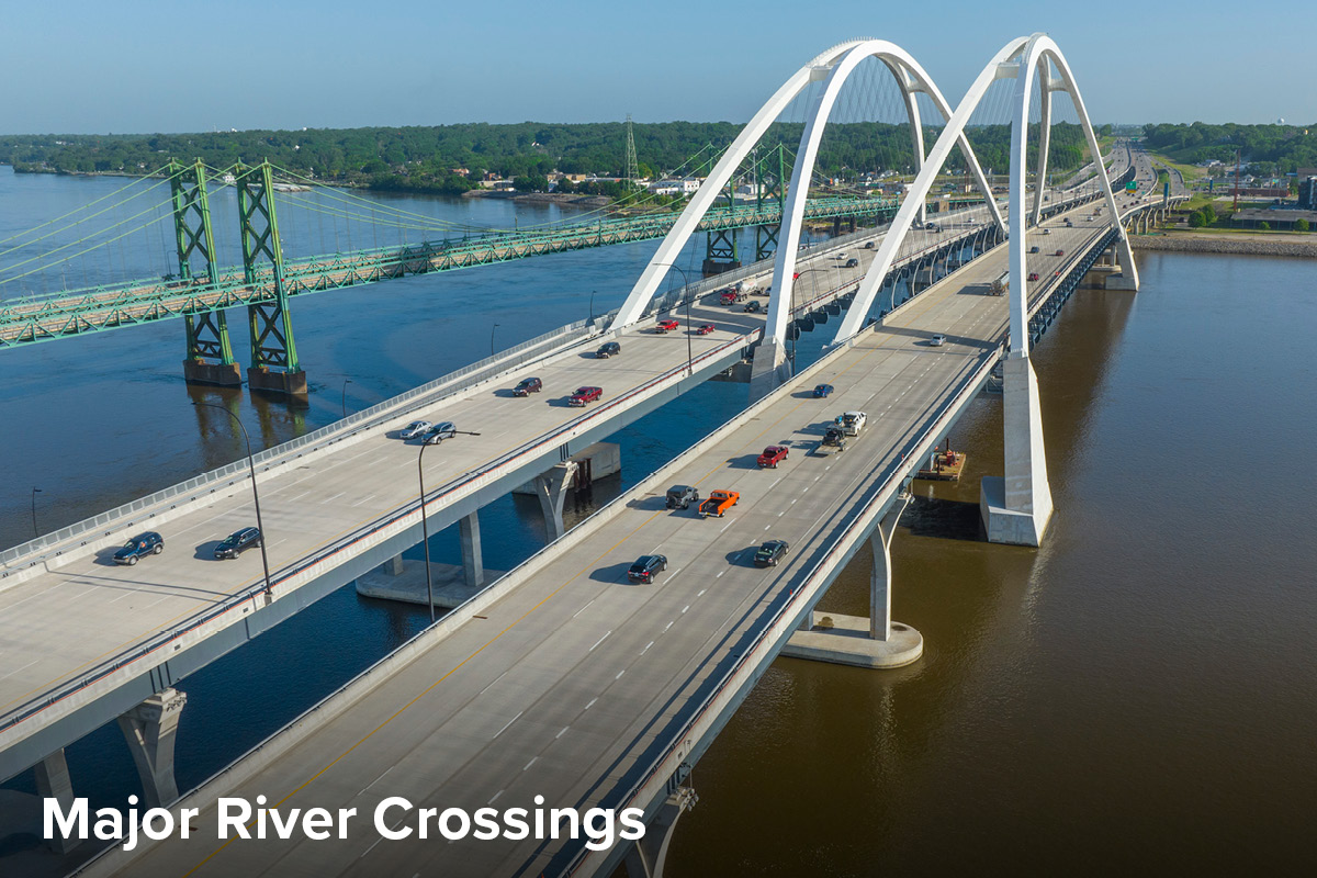 Aerial view of the newly constructed I-74 Mississippi River bridge, consisting of two arch structures carrying four lanes of traffic each