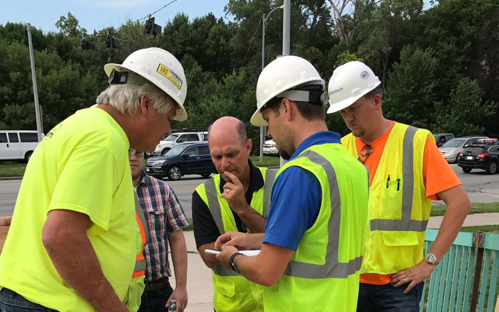 Photo of Benesch construction team reviewing a project schedule