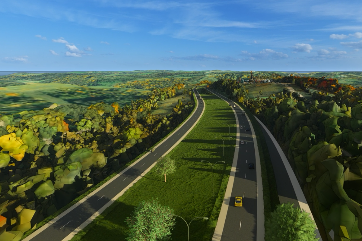 screenshot from a 3D video of a new four lane divided highway, showing traffic passing in all lanes