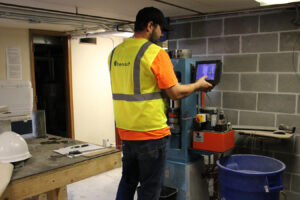 Photo of Benesch's employee utilizing state of the art technology to analyze slope stability