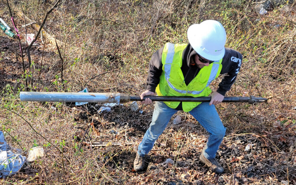 Photo of Benesch's employee performing a sampling in the field