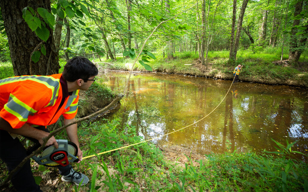 Photo of Benesch employees performing environmental field work