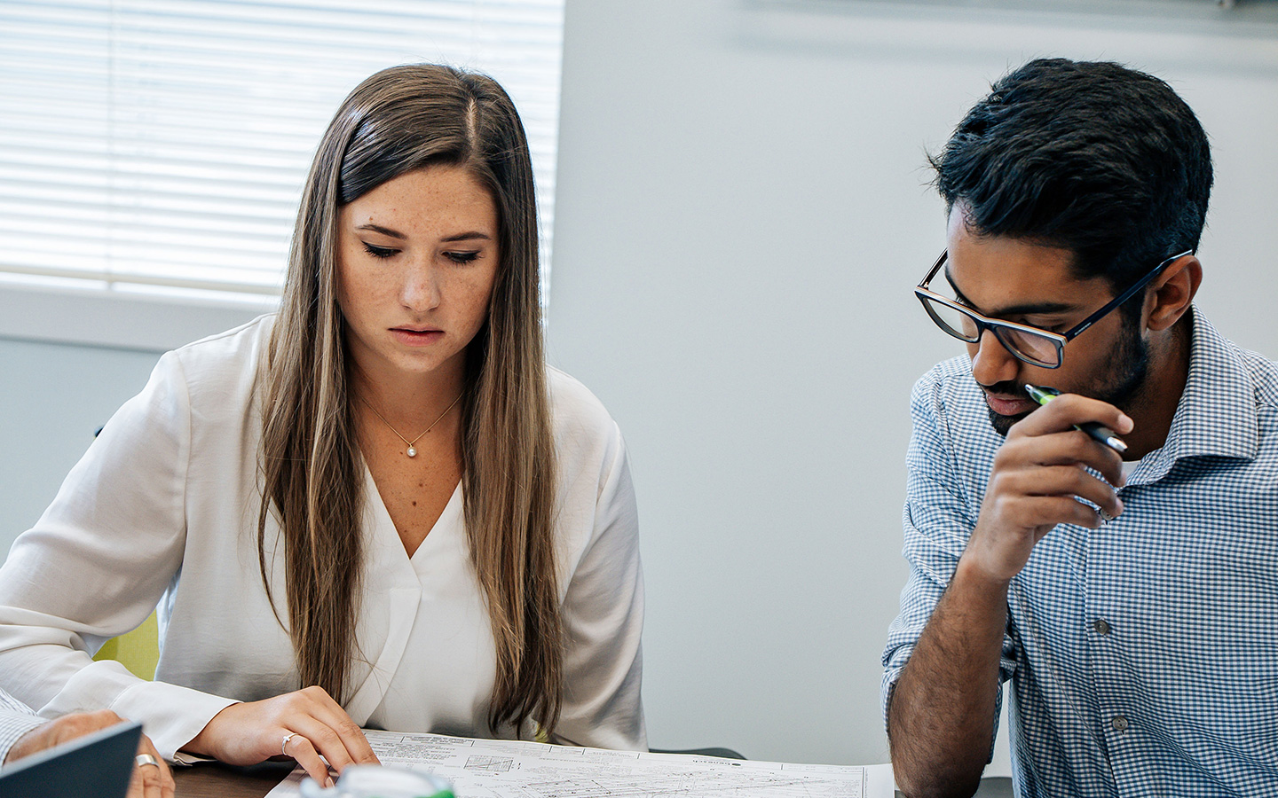 Photo of Benesch's planning team reviewing a project schedule