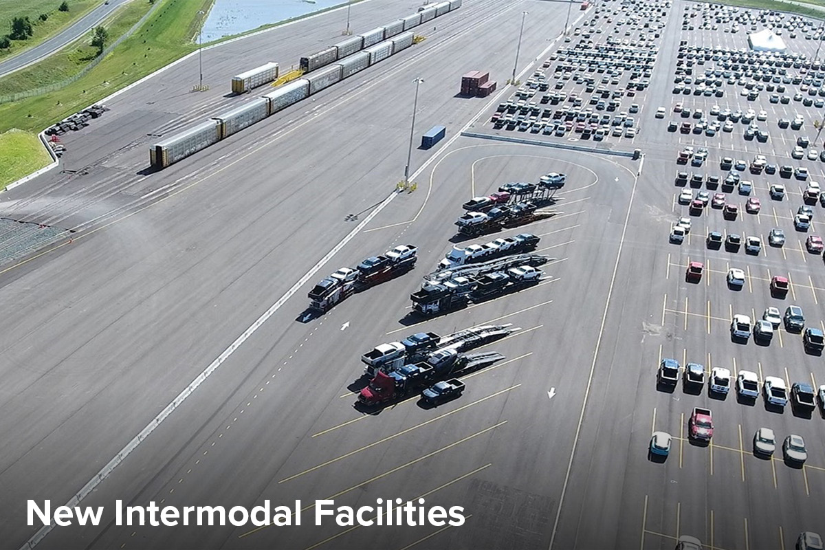 Aerial view of a new intermodal station in Wisconsin, showing several train lines running adjacent to a parking lot