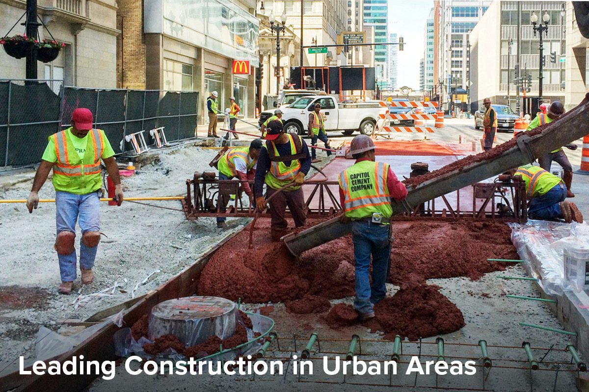 construction team pouring concrete for a new dedicated bus lane in Chicago's loop as part of the Bus Rapid Transit Loop Link project