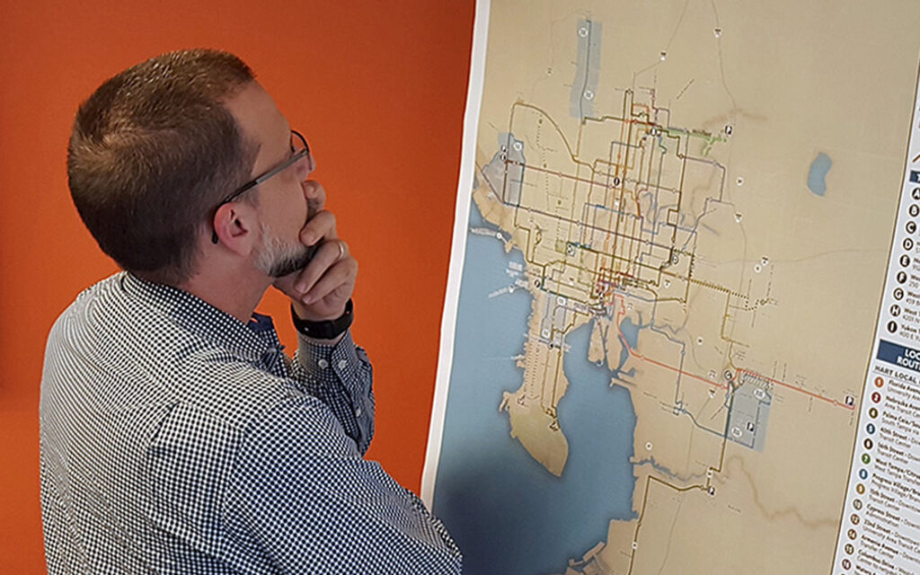 Man reviewing map on board