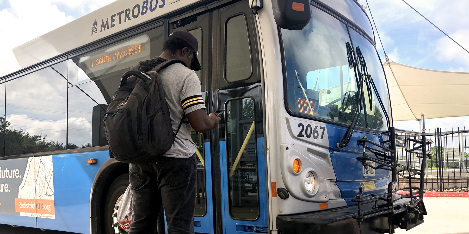 Man getting on a bus