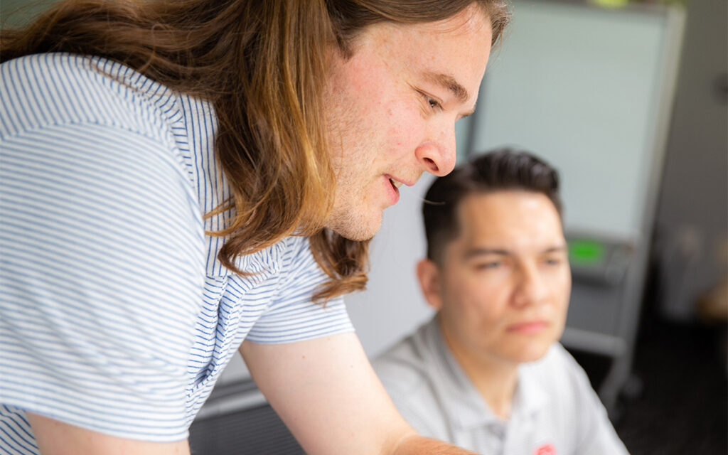 Close-up photo of Benesch employees mentoring one another