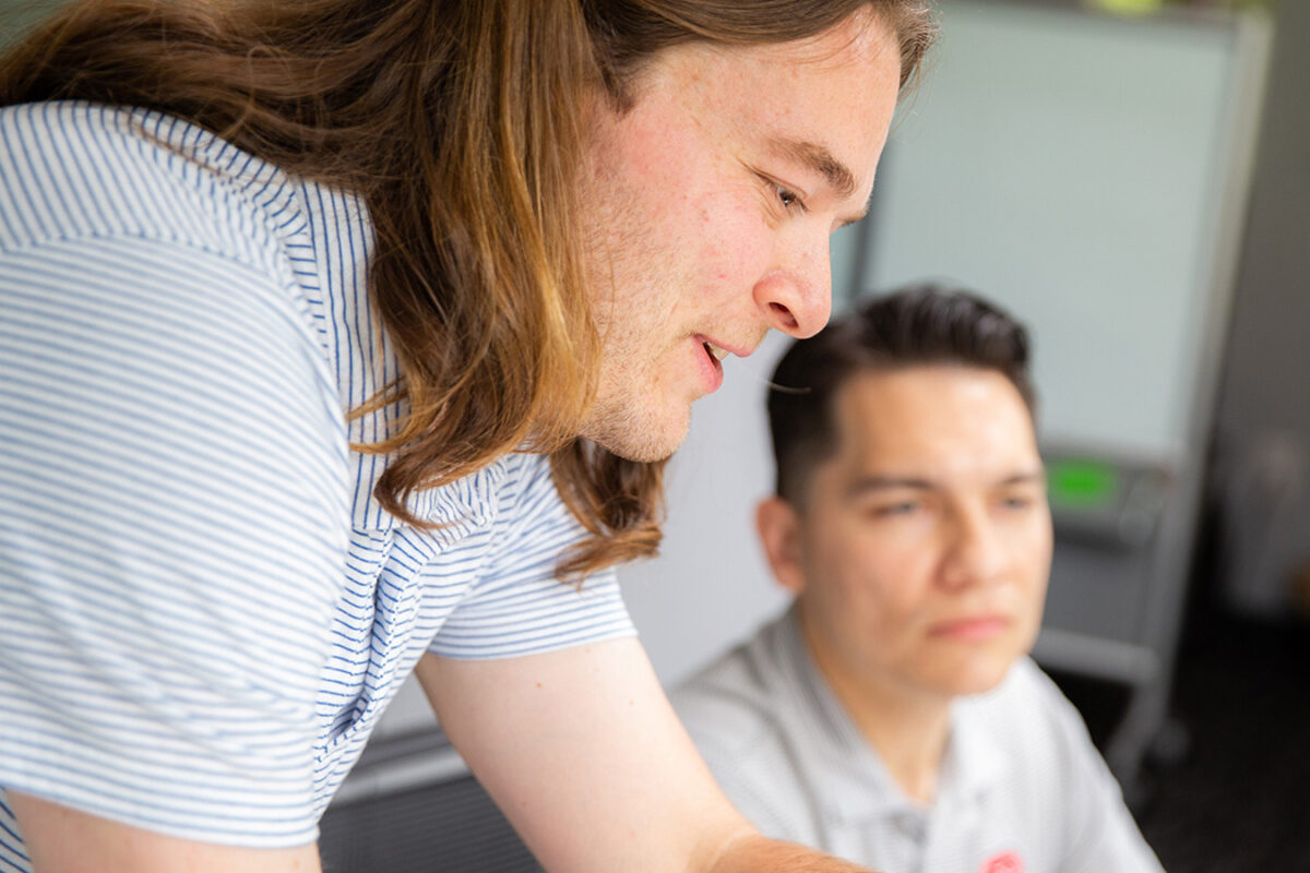 Close-up photo of Benesch employees mentoring one another