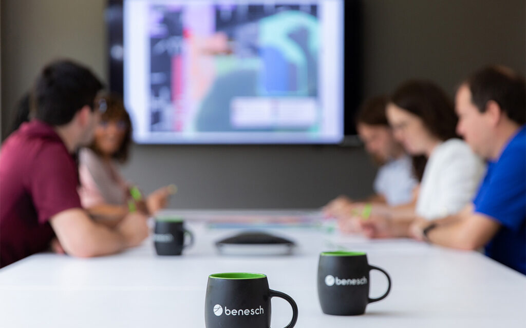 Photo of Benesch employees meeting in a conference room