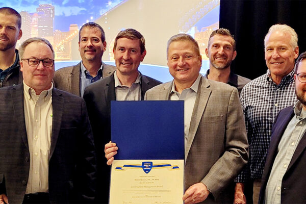 A photo of Dan Gross and project team with ASCE award