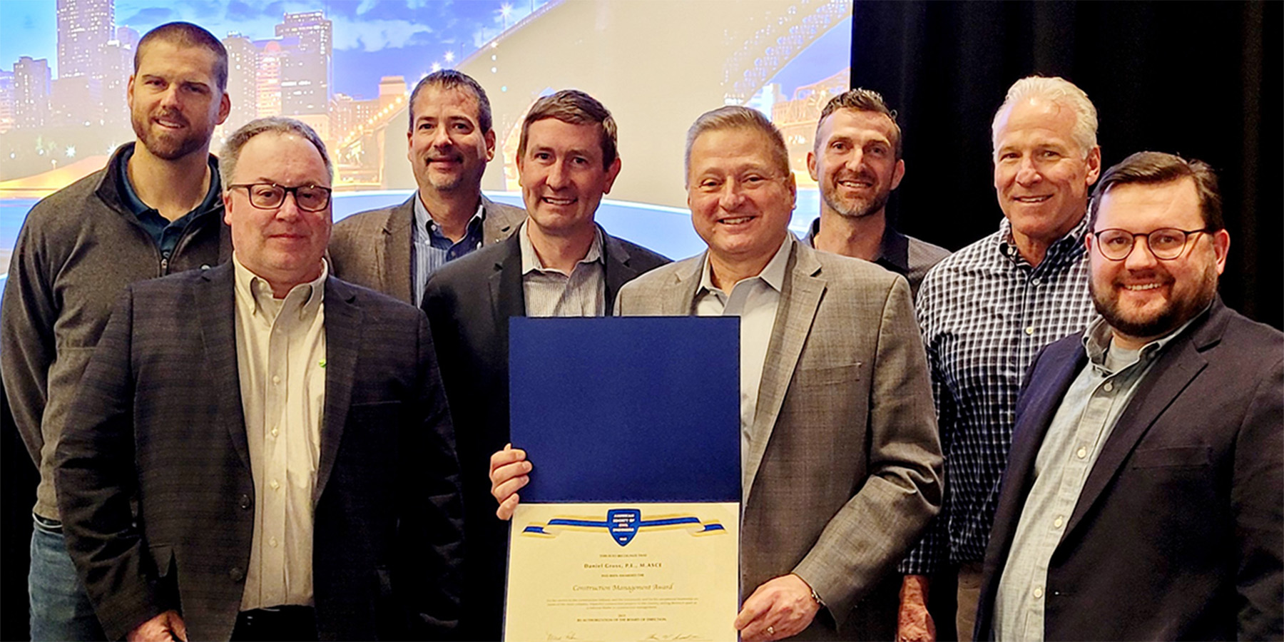 A photo of Dan Gross and project team with ASCE award