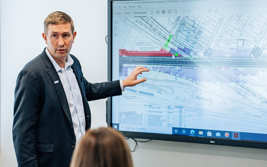 Photo of Benesch employee presenting in a conference room