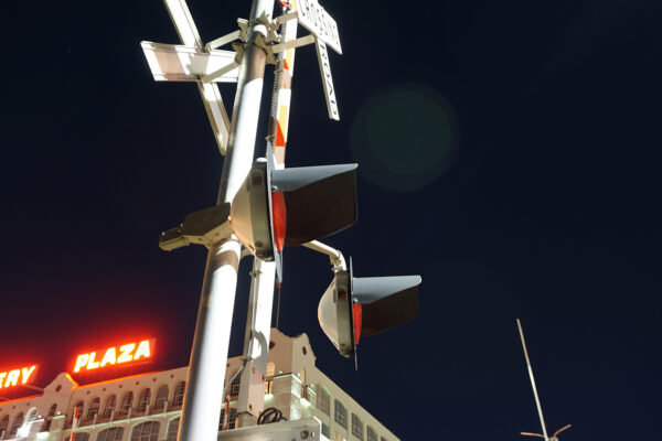 photo of a grade crossing signal at night