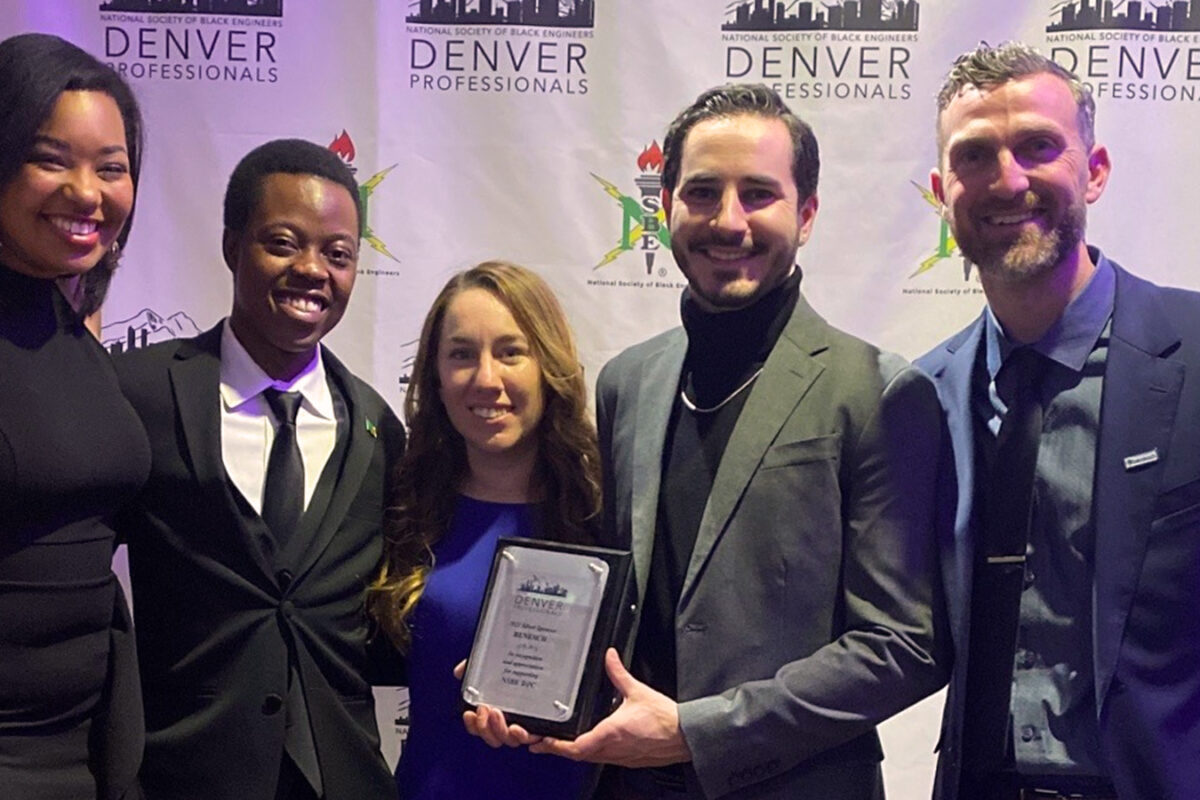 Group photo of Benesch employees at an award ceremony