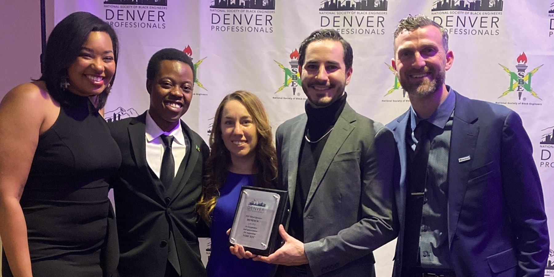 Group photo of Benesch employees at an award ceremony