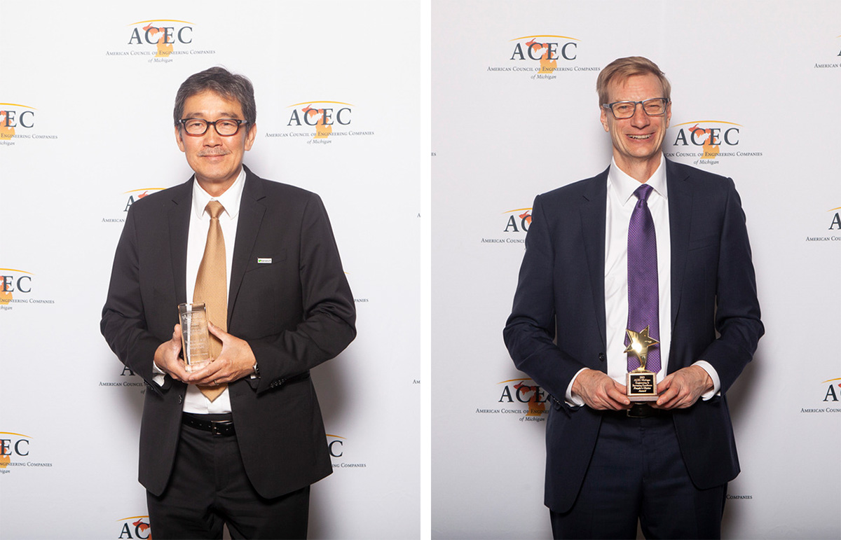 A photo of Peck-Hee Wee and Doug Strauss with awards at the ACEC gala