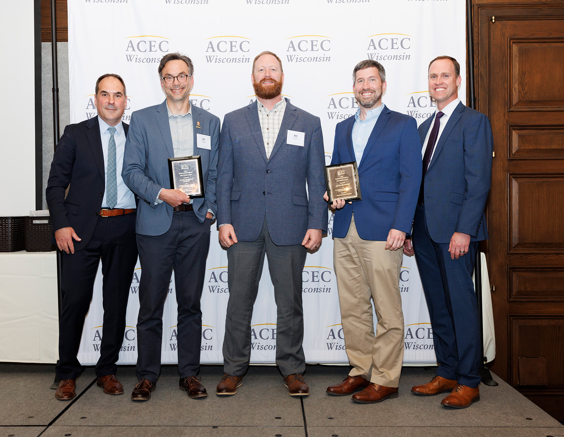 A photo of the Michigan Street project team with ACEC award