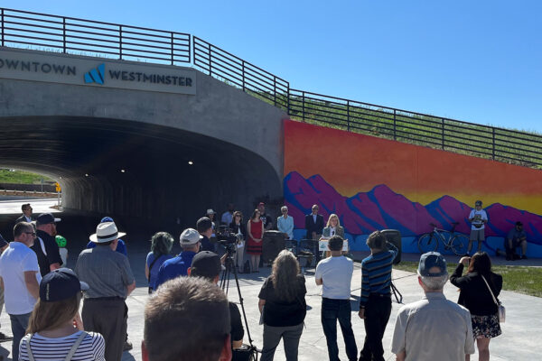 A photo of the underpass ribbon cutting and crowd