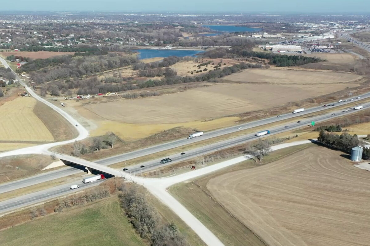 A photo from above showing I-80 and a highway bridge