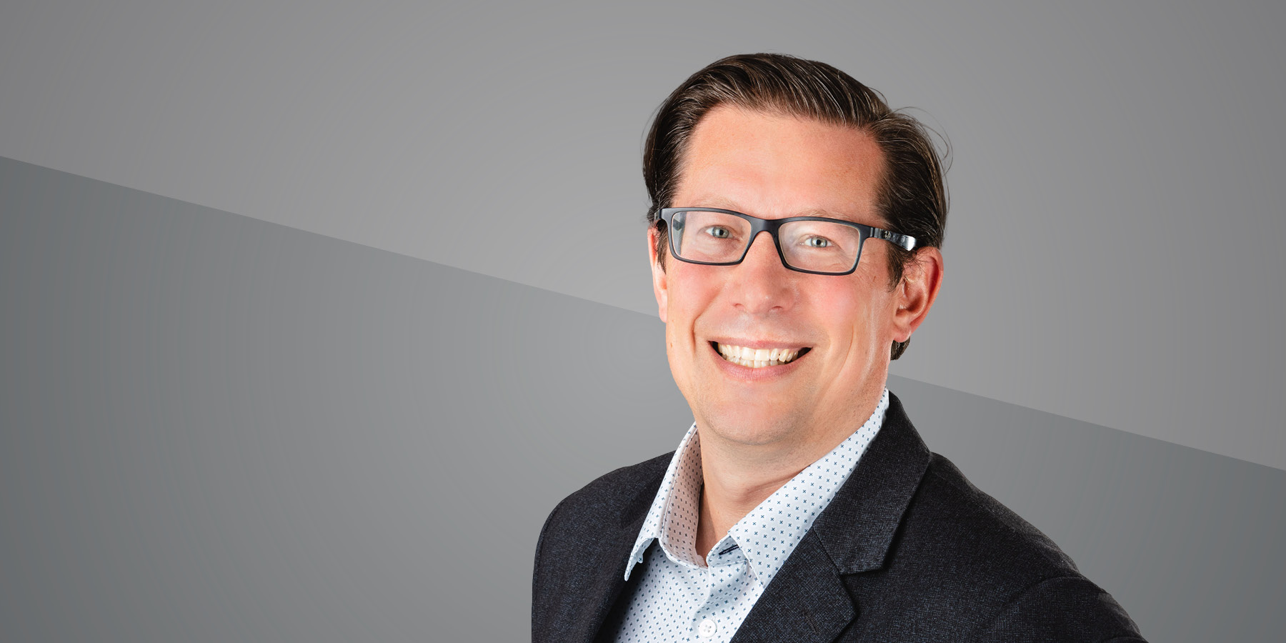 A photo of Travis Kluegel smiling