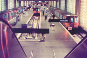 Historic photo of the O'Hare CTA station in Chicago, showing trains pulling into the platforms underground