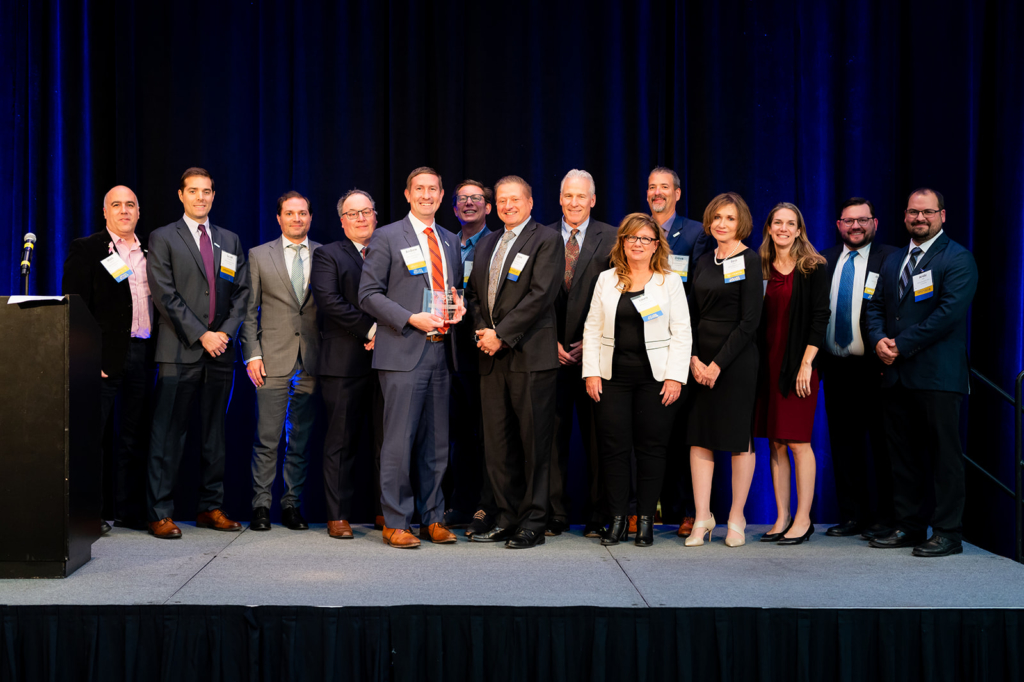 A photo of a group of Benesch employees holding an award at the ASCE awards gala