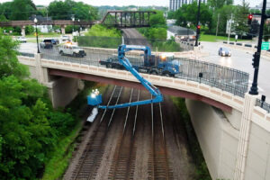 Aerial photo of Benesch's staff performing a bridge inspection