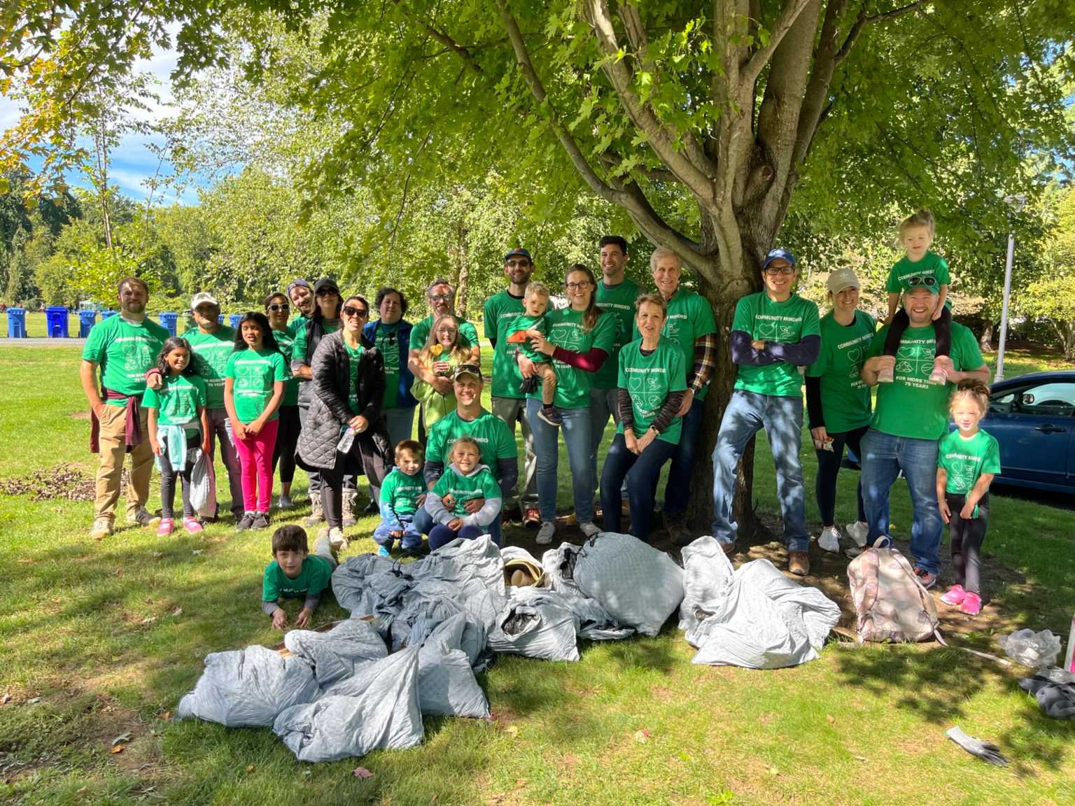 A photo of employees with trash collected from the Connecticut River