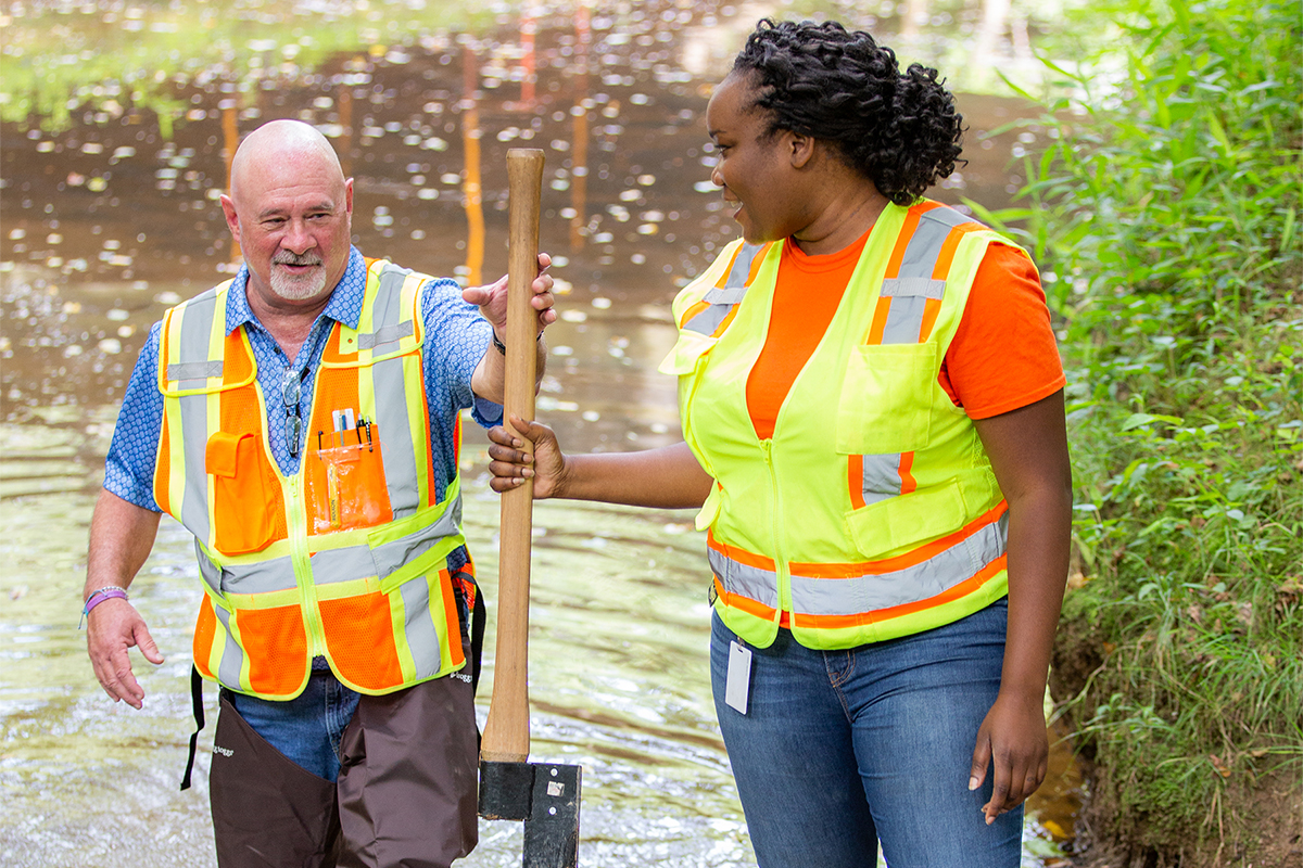 photo of Benesch team members surveying scour in a creek