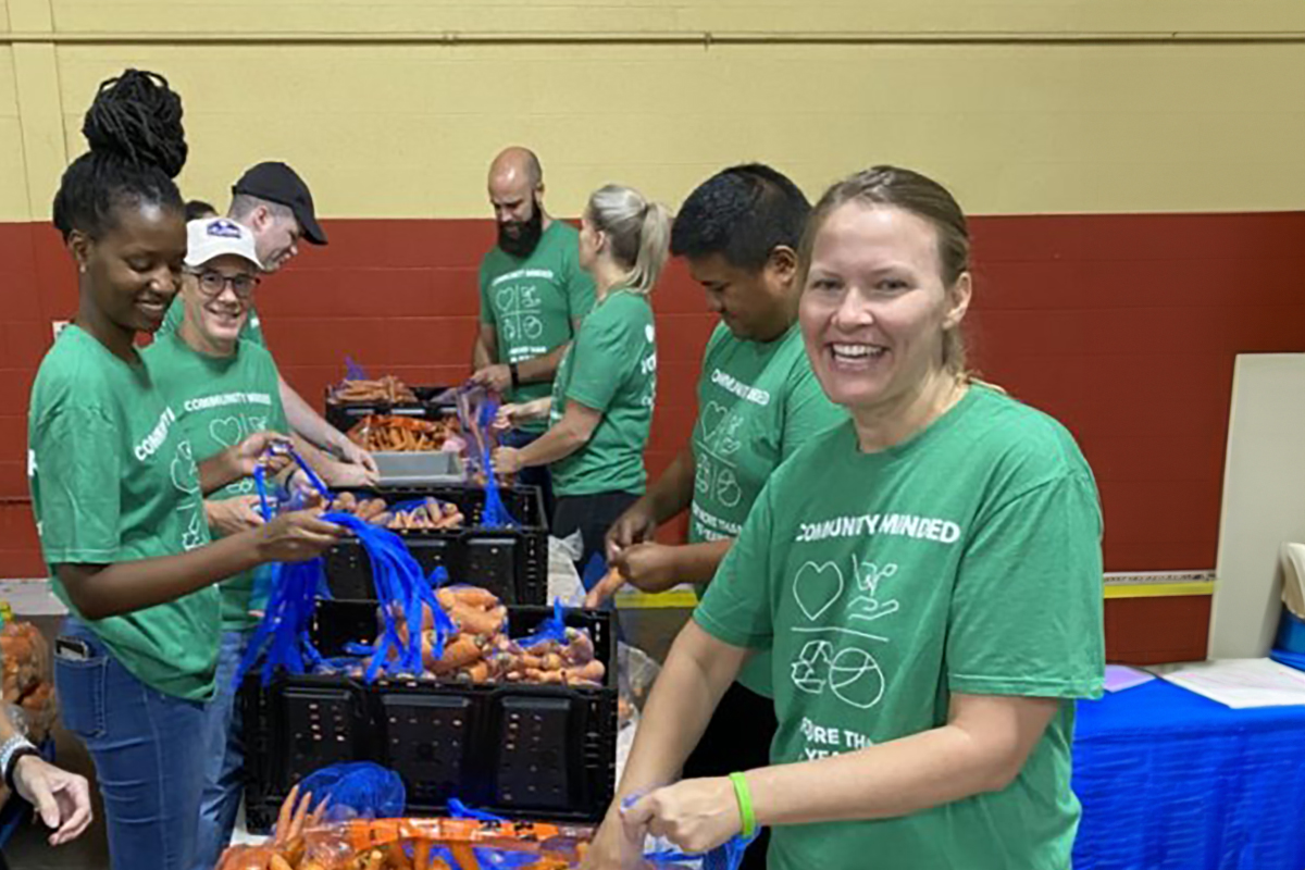 Benesch employees cleaning carrots for a food pantry in Kansas City