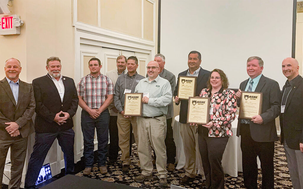 Photo of Benesch's team receiving the ASHE award