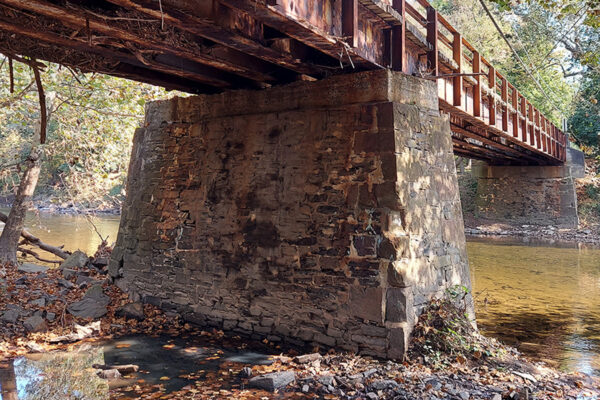 A photo of the underneath of Worthington Mill Road Bridge over a river