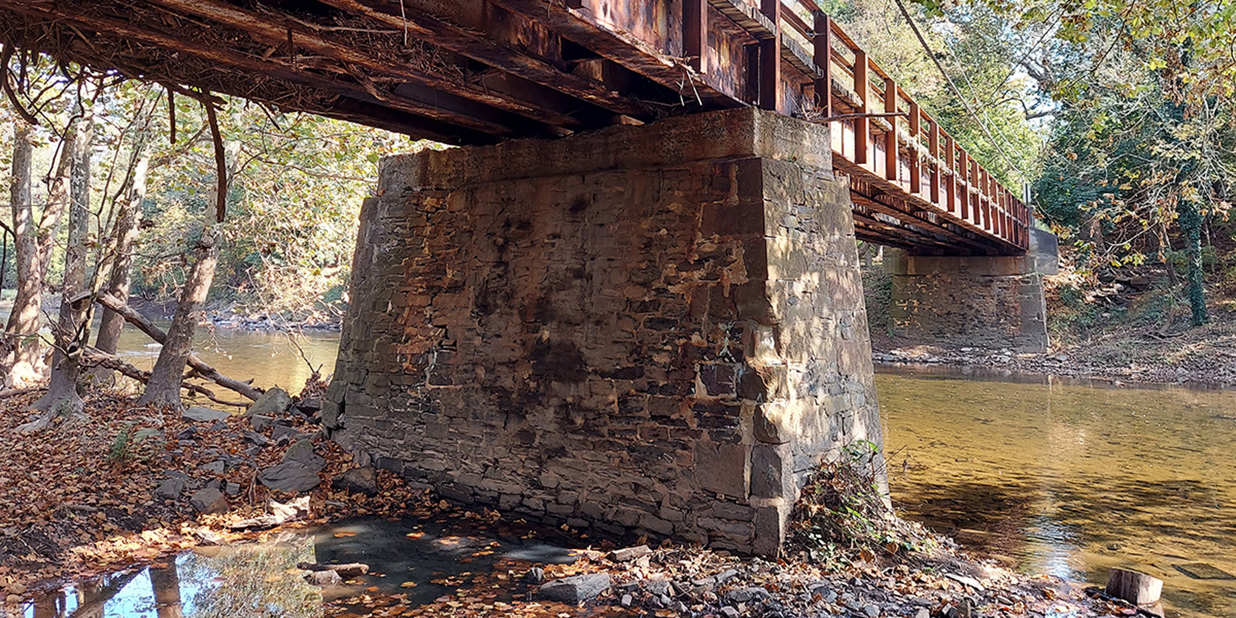 A photo of the underneath of Worthington Mill Road Bridge over a river