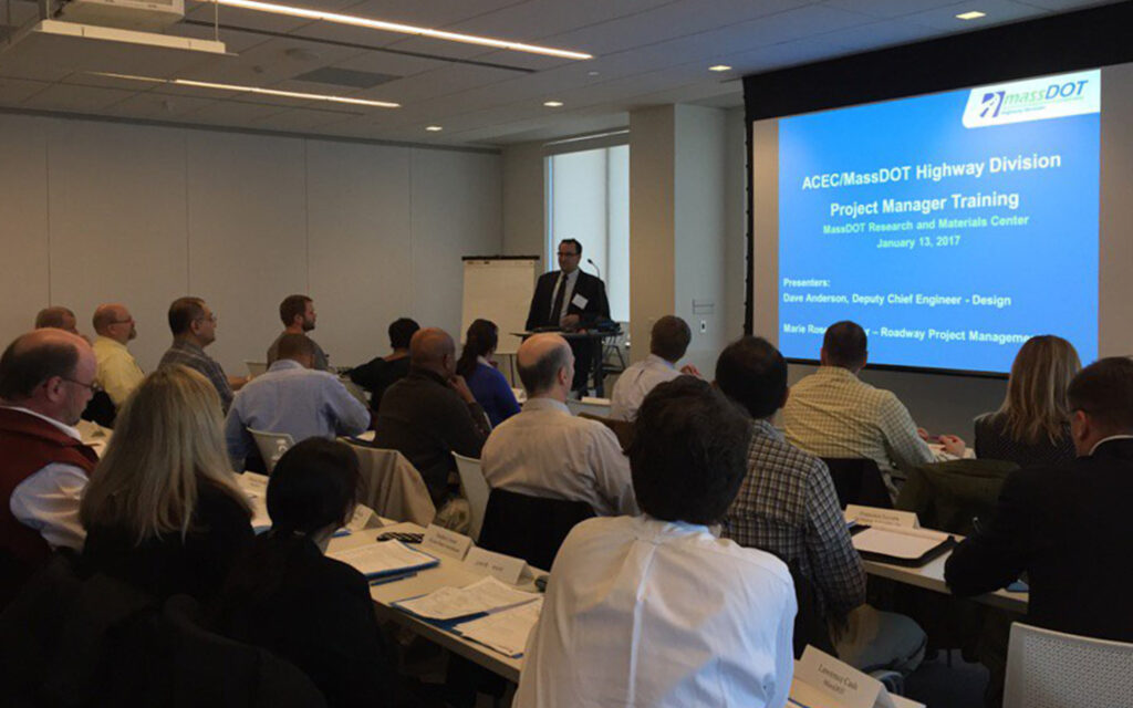 Photo of Benesch's employee Ed Baumann presenting at ACEC/MassDOT project manager training