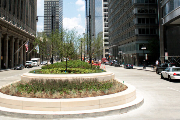 view of the upper level of Wacker Drive between Adams and Randolph Streets, with the Lyric Opera House to the left