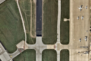 Aerial view photo of airport runway and airplanes