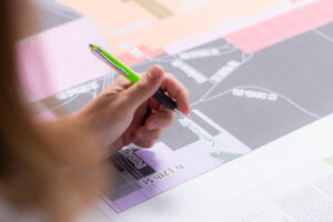 Close-up photo of Benesch employee reviewing a map