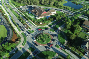 Aerial view photo of a roundabout in a neighborhood