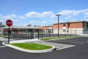 Photo of a school parking lot and pedestrian crossing