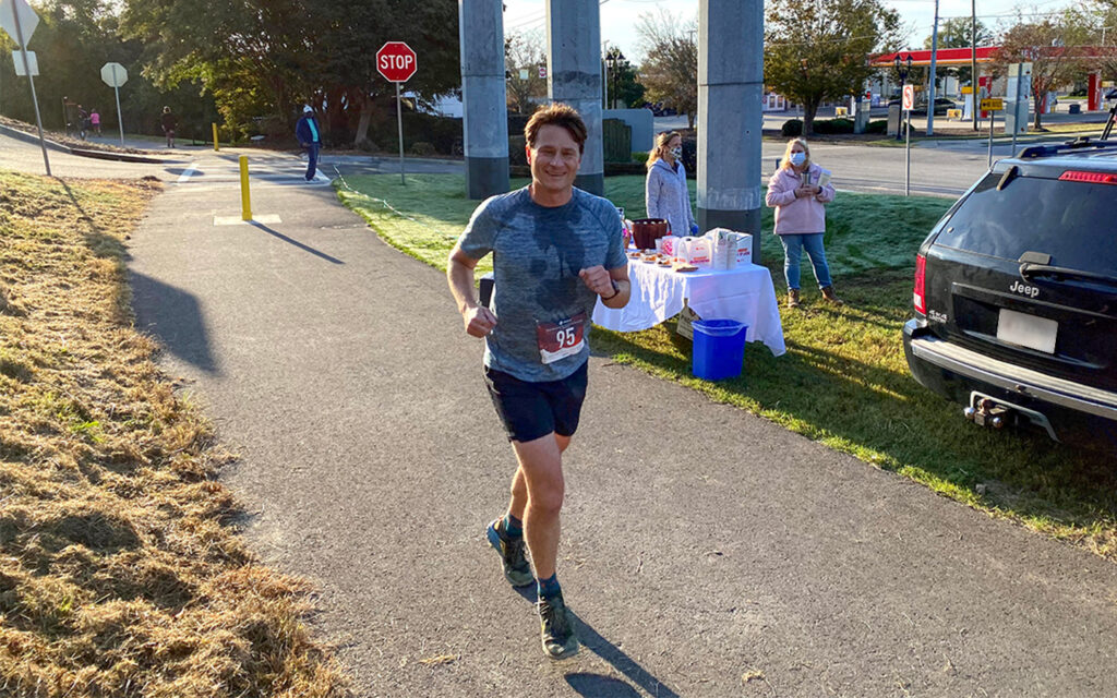 Photo of Benesch's employee participating in the Hawk's Gully Hurdle 10K in celebration of the River Levee Trail opening.