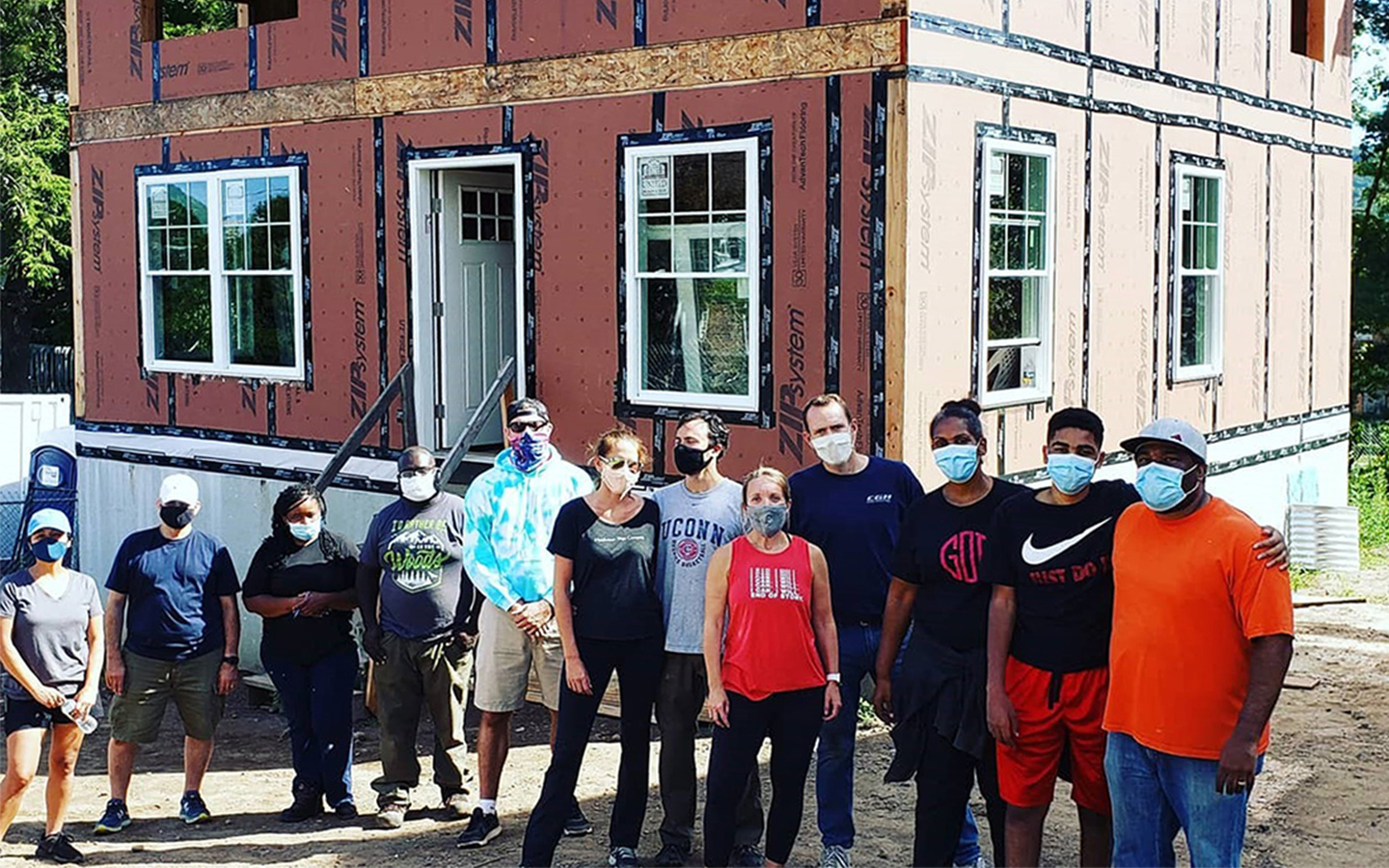 Photo of Benesch employees volunteering at a house built for Habitat for Humanity in Glastonbury