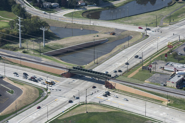 Aerial view of the Rollins Road Gateway, which includes a new railroad bridge crossing over the intersection of IL 83 and Rollins Road in Round Lake Beach, IL