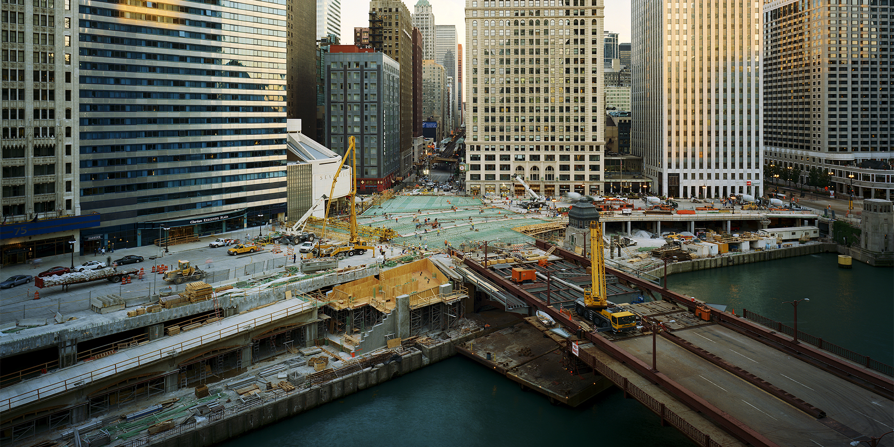 view of construction on Wacker Drive in downtown Chicago, taken from across the river