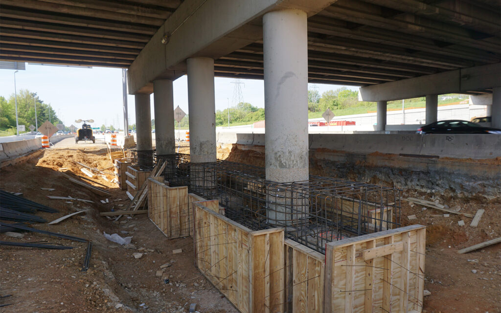 Photo of the existing concrete columns that were retrofitted with cylindrical steel casings to improve column ductility and bring them into conformance with current design standards without adding weight or rigidity to the Park Avenue structure.