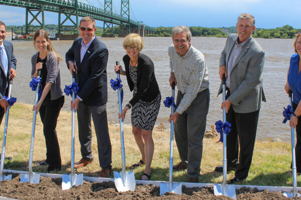 Group photo of Benesch staff and other local and state officials at the I-74 over the Mississippi River Bridge groundbreaking ceremony