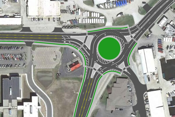 2D rendering of a new roundabout connecting IL 59 and Grand Avenue. The intersection carries multiple lanes in each direction through a commercial area.